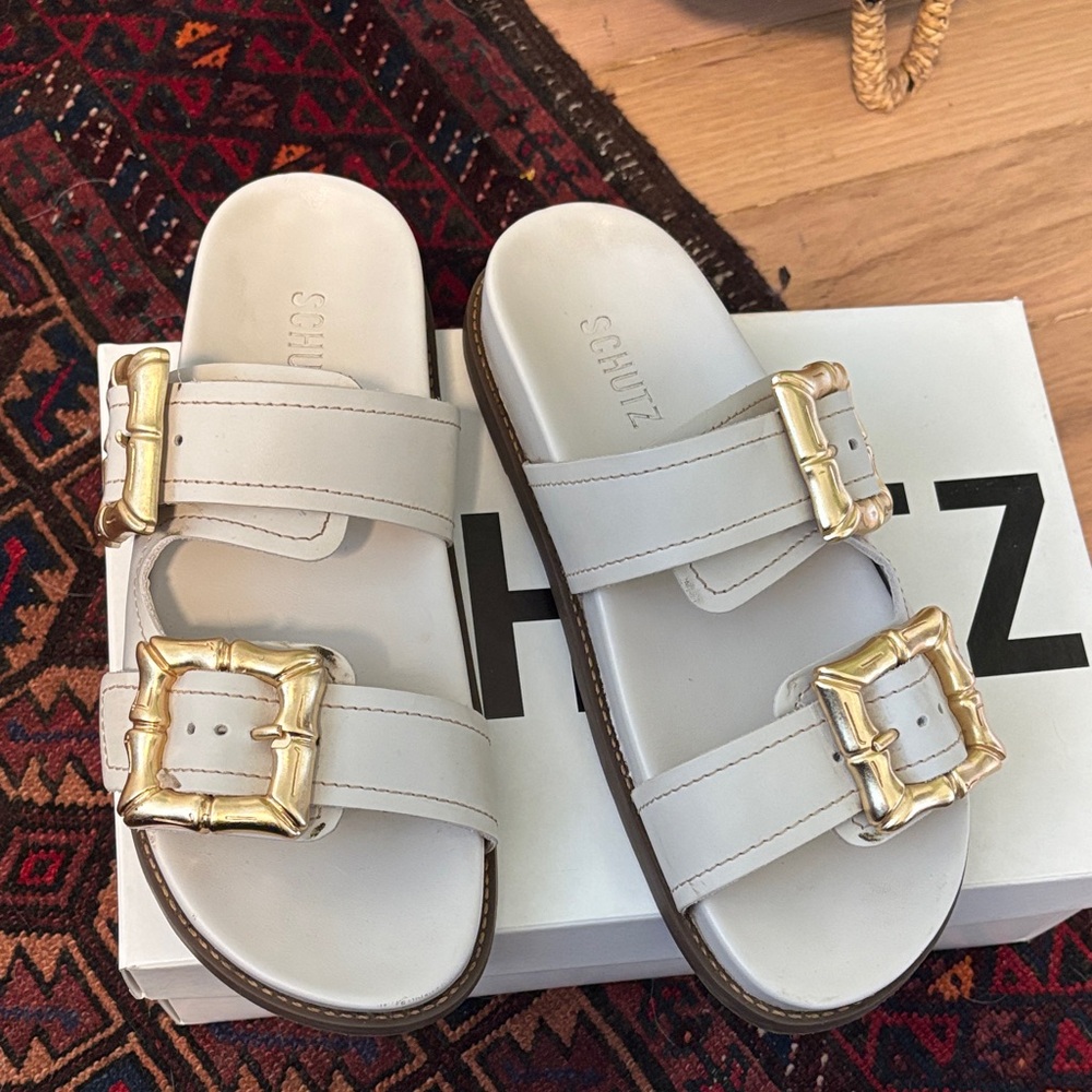 SCHUTZ White Slides with Gold Accents